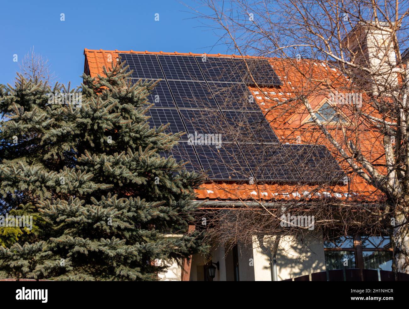 Solar electric panels on a house roof Stock Photo Alamy