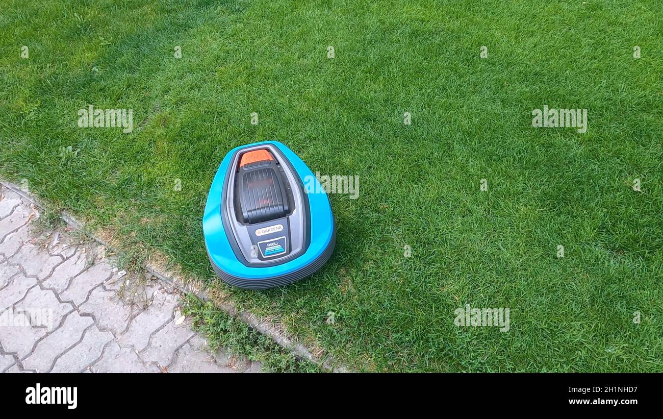 Kyiv, Ukraine - August 24, 2020: Robotic lawn mower Gardena on grass in side view Stock Photo