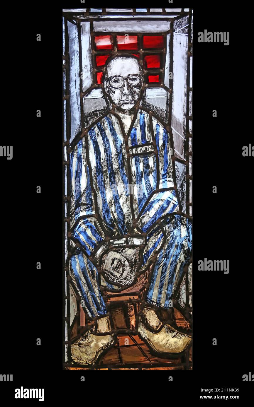 Saint Maximilian Kolbe, stained glass window by Sieger Koder in St. John church in Piflas, Germany Stock Photo