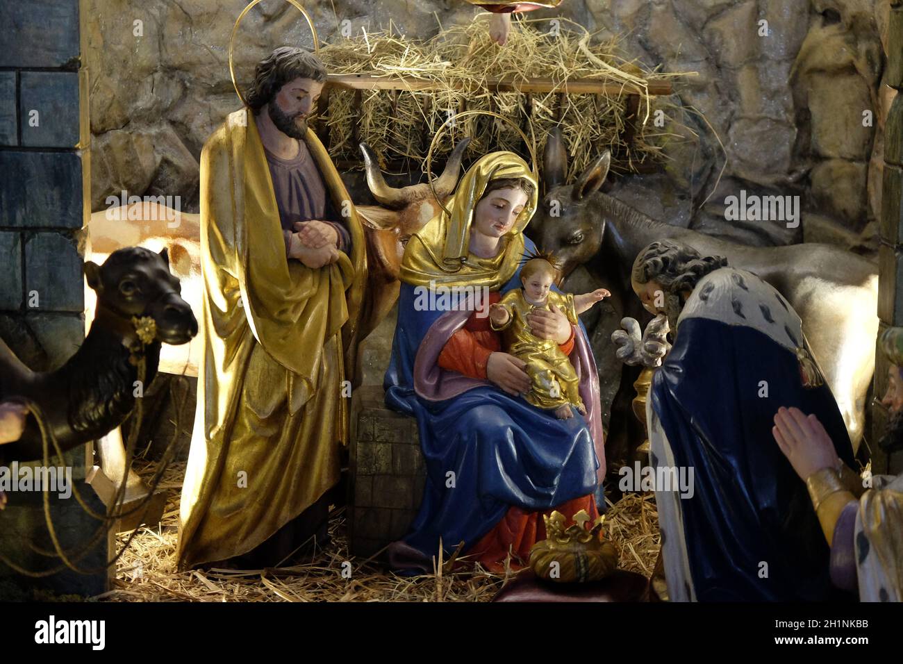 Holy family with the infant jesus in the crib hires stock photography