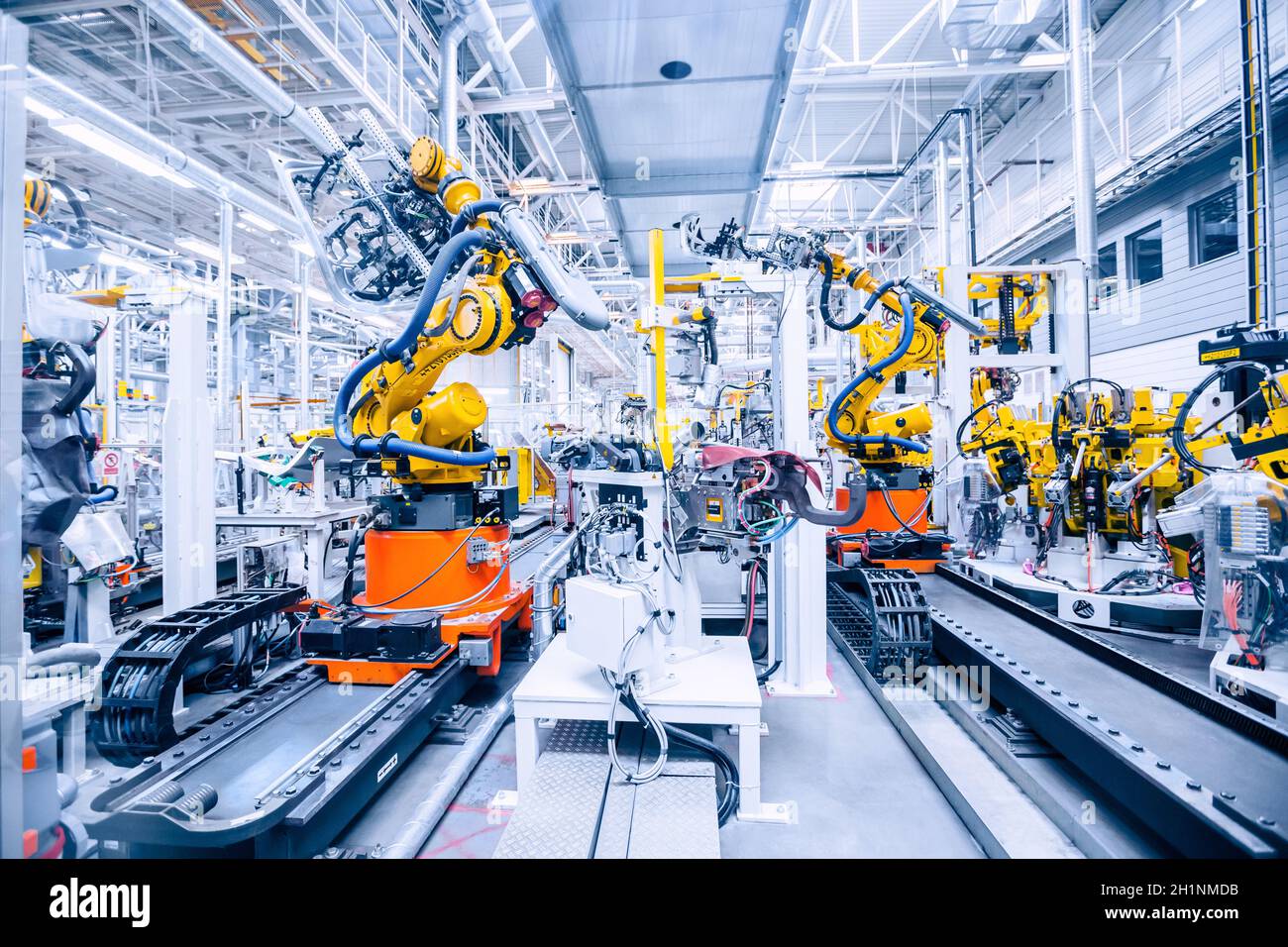 robotic arms in a car plant Stock Photo