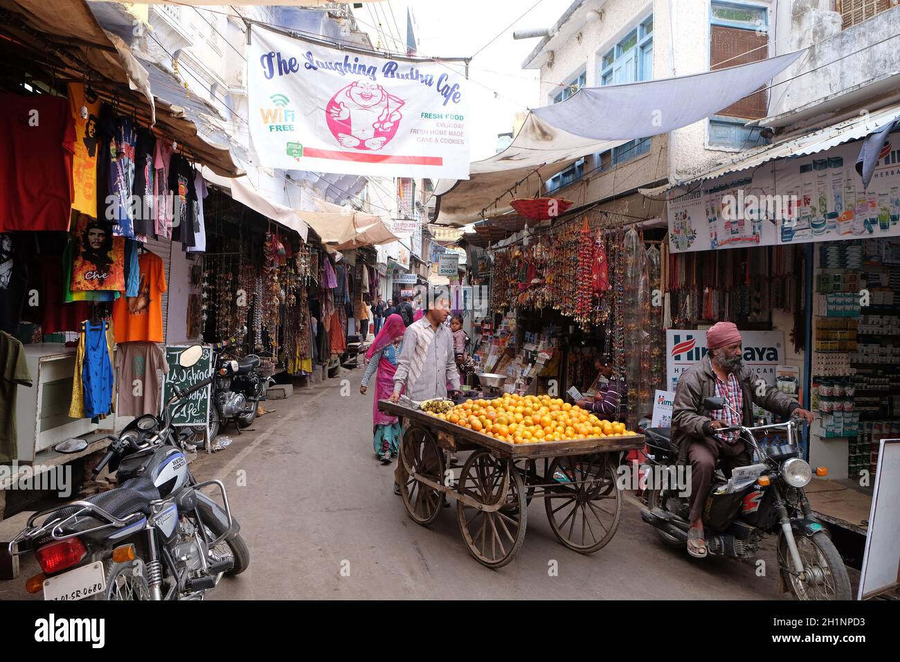 People walk around downtown in Pushkar, India. The city is one of the five sacred dhams for devout Hindus, in Pushkar, Rajasthan, India. Stock Photo