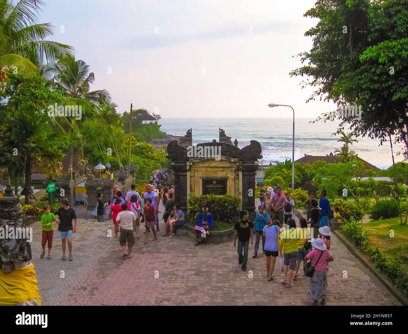 Bali, Indonesia - December 28, 2008: People going at Tanah Lot and sea  waves in golden sunset at Bali Stock Photo - Alamy