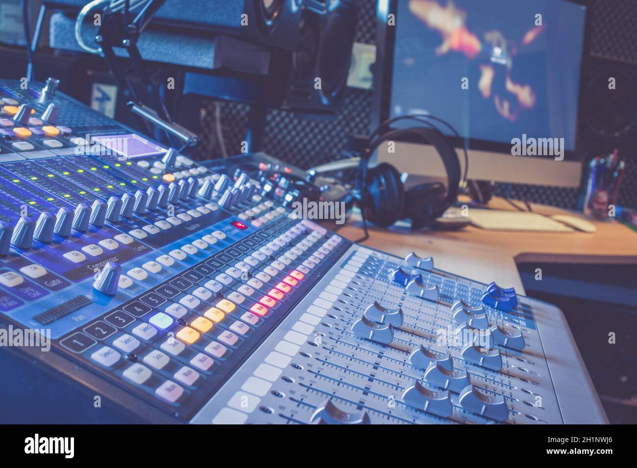 Professional music production in a sound recording studio, mixer desk ...