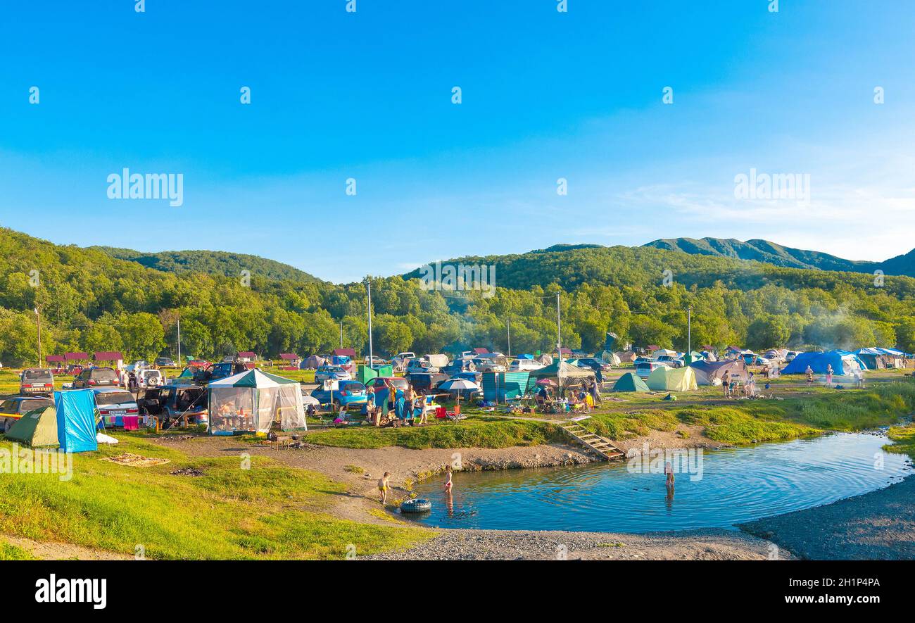 KAMCHATKA, RUSSIA - JULE 27 2019: Tent camp in Malka near the hot mineral springs Stock Photo