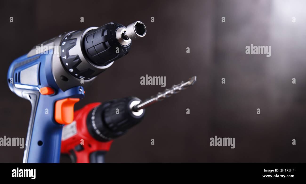 A screw gun and a pistol-grip cordless drill. Stock Photo