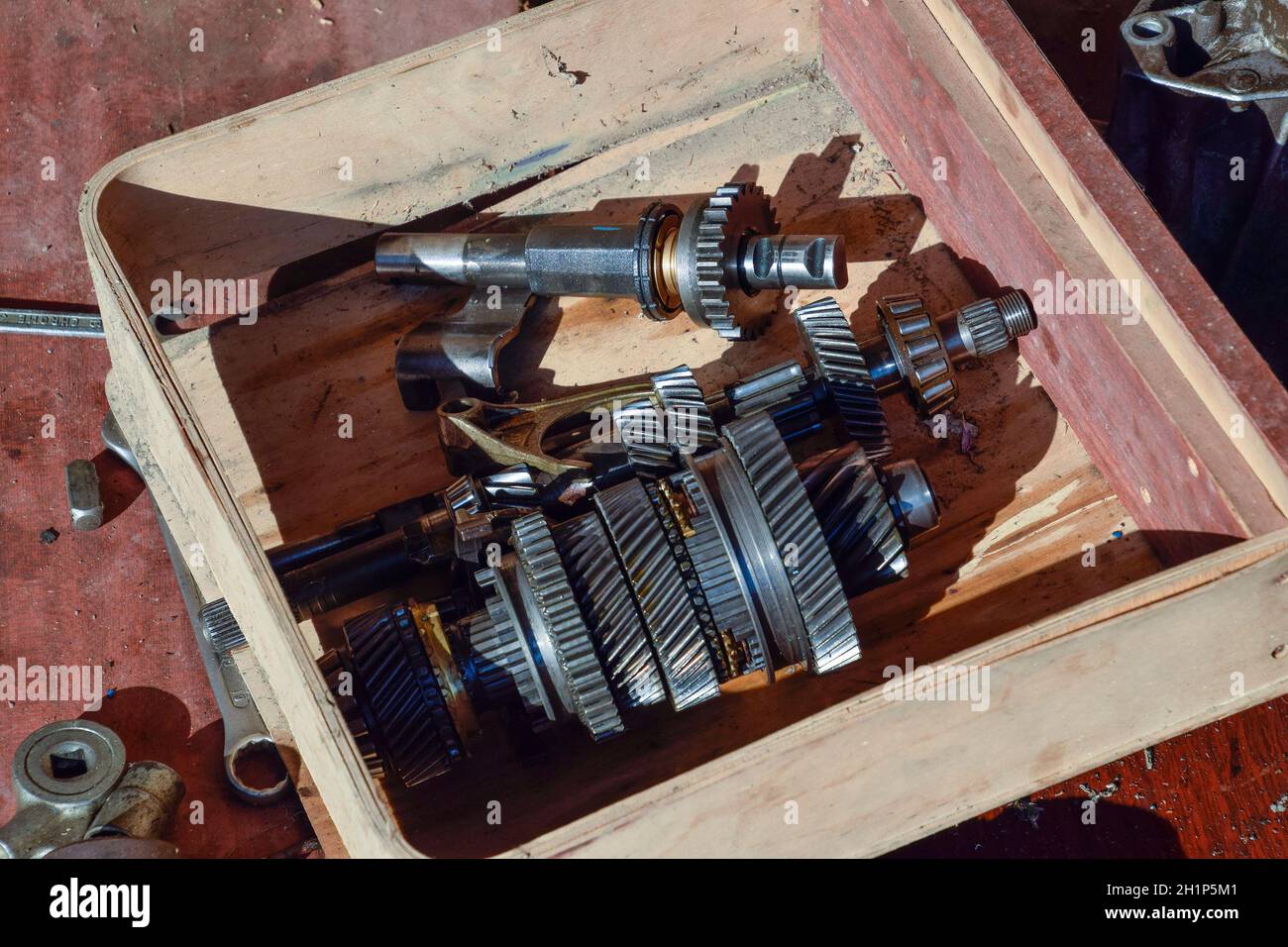 Dismantled box car transmissions. The gears on the shaft of a mechanical transmission. Stock Photo