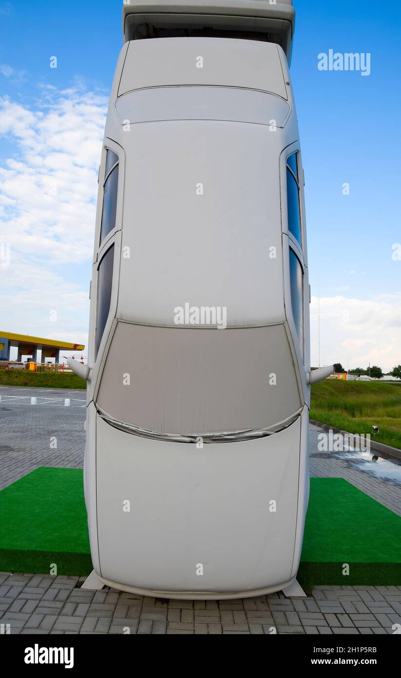 Homemade sculpture of three cars. Monument to the cyrillic letter P