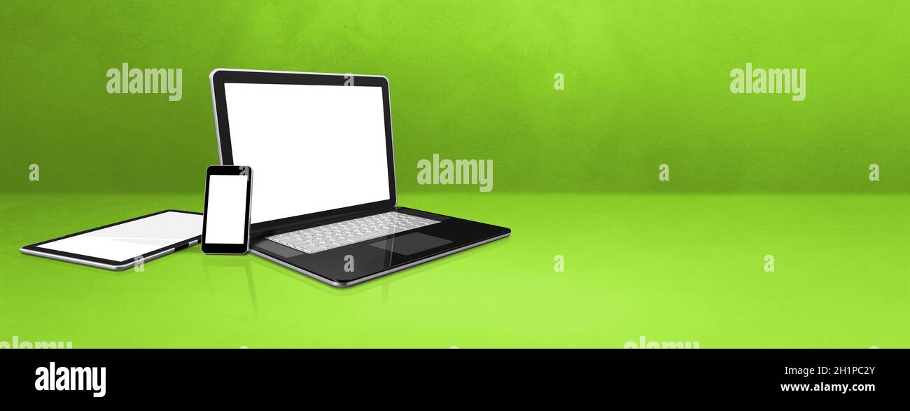 Laptop, mobile phone and digital tablet pc on green office desk. Banner background. 3D Illustration Stock Photo