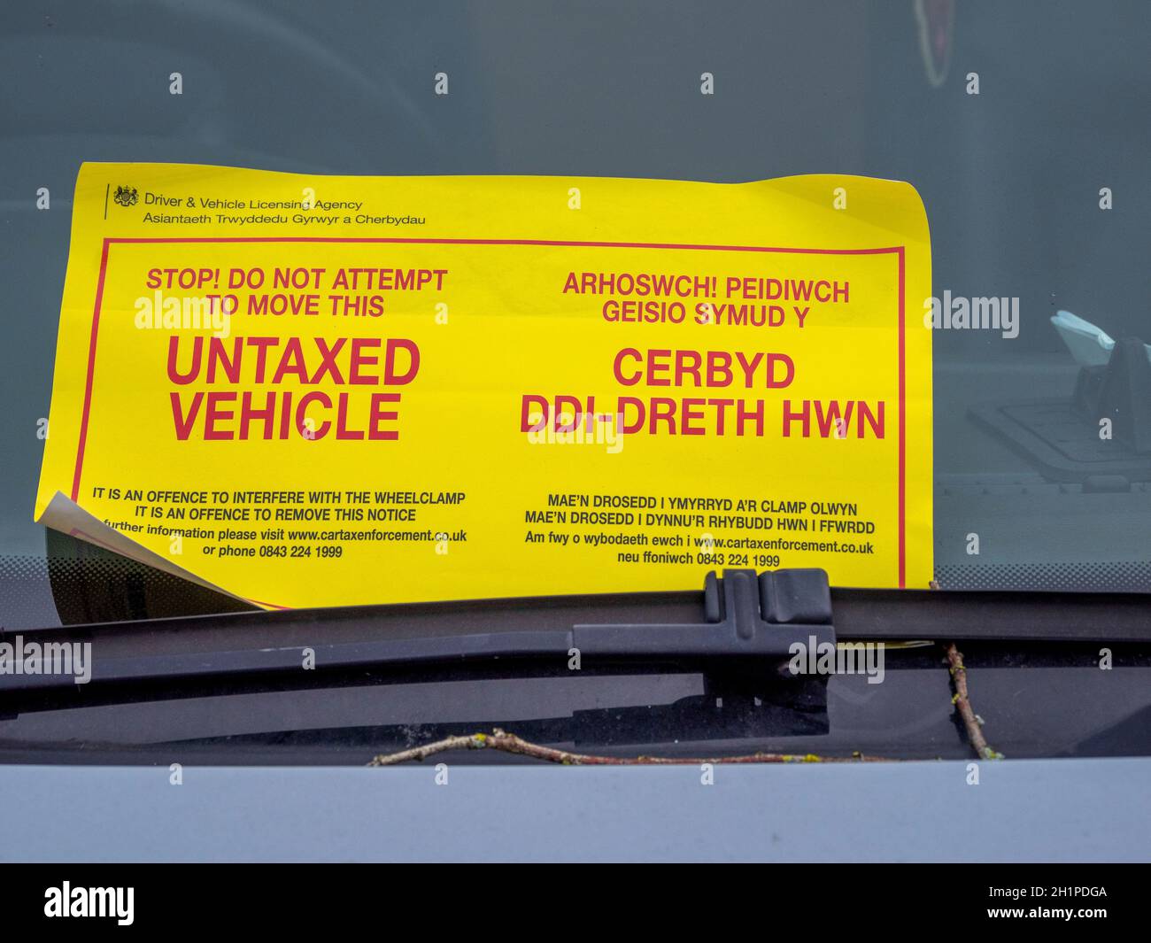 Notice at a Car windshield for Untaxed Vehicle Cardiff Stock Photo Alamy