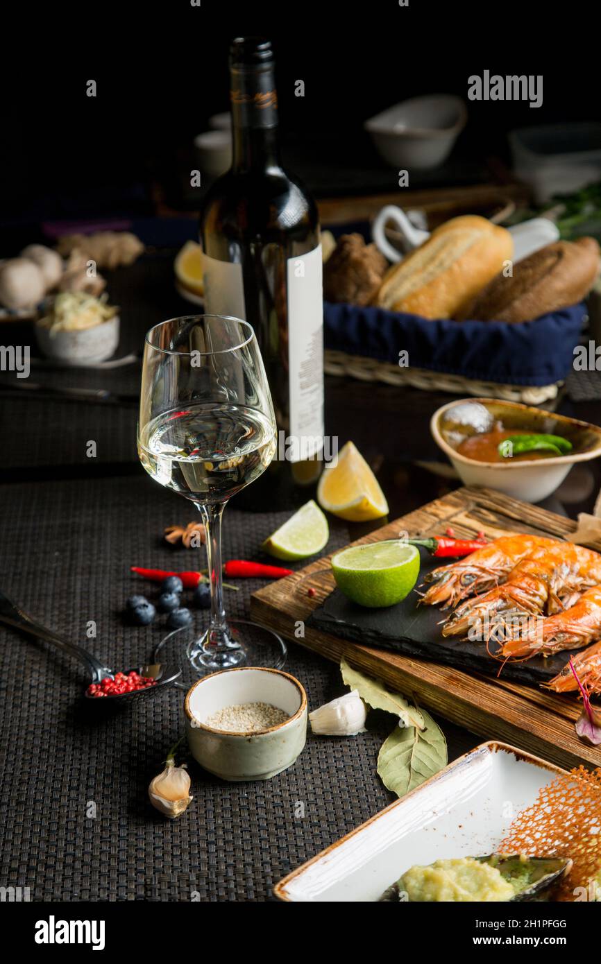 glass of semidry white wine, an aperitif. Wine with grilled meat and