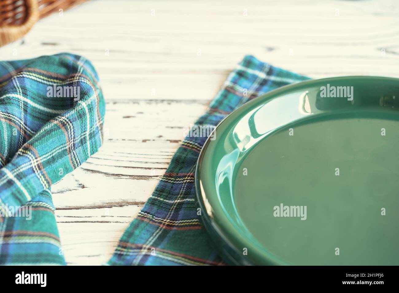 Green plastic kitchenware on a table close up Stock Photo