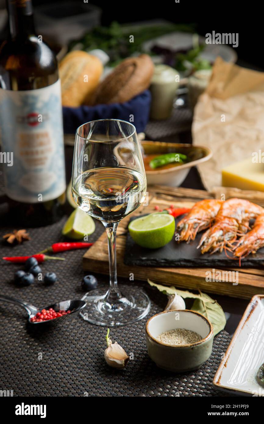 glass of semidry white wine, an aperitif. Wine with grilled meat and