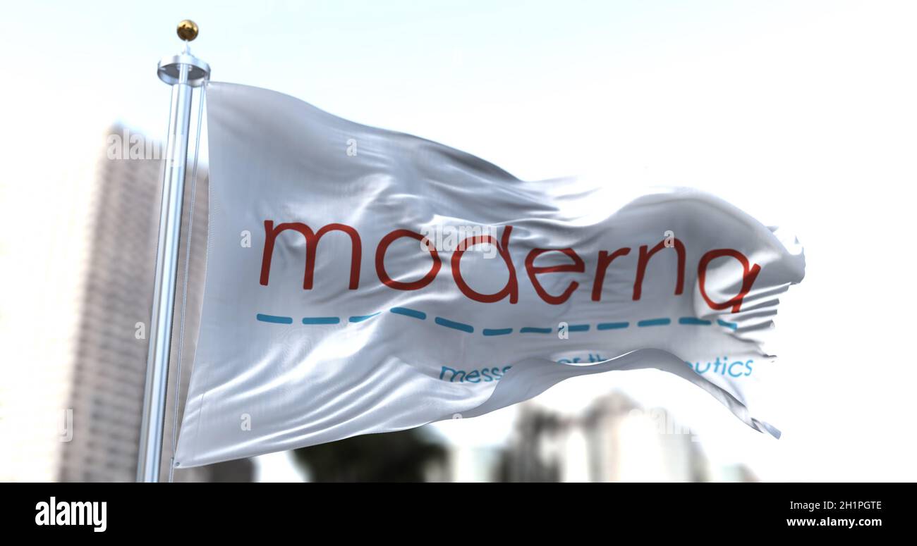 Cambridge, MA, USA, January 26, 2021: White flag with the new Moderna logo waving in the wind. Moderna is an american pharmaceutical company that has Stock Photo