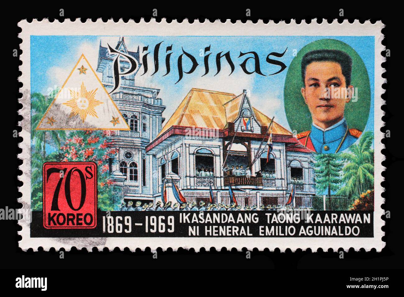 Stamp printed in Philippines from the Birth Centenary of President Emilio Aguinaldo issue shows President Aguinaldo and Cavite Building, circa 1969. Stock Photo