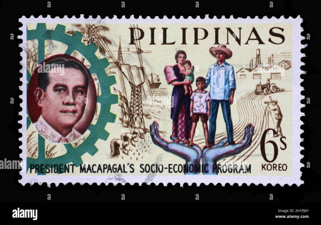 Stamp printed in Philippines shows President Macapagal and Filipino family, Series 5-year Socioeconomic Program, circa 1963. Stock Photo