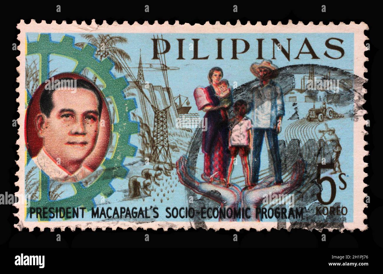 Stamp printed in Philippines shows President Macapagal and Filipino family, Series 5-year Socioeconomic Program, circa 1963. Stock Photo