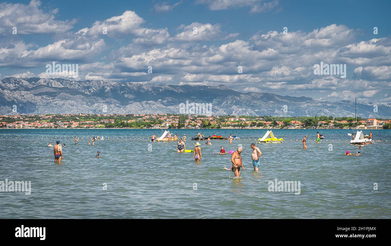 Nin Croatia July 2019 People Relaxing And Having Fun In Water Of nin-croatia-july-2019-people-relaxing-and-having-fun-in-water-of