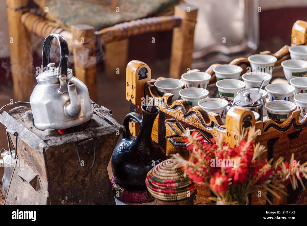 place with cups of Ethiopian coffee served with aromatic essence called buna. Frankincense and myrrh ignited by a hot coal to produce smoke that carri Stock Photo