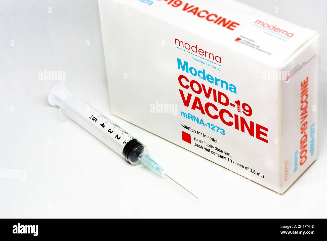 Cambridge, MA, USA, february 5th 2021: A syringe next to the ModeRNa ...