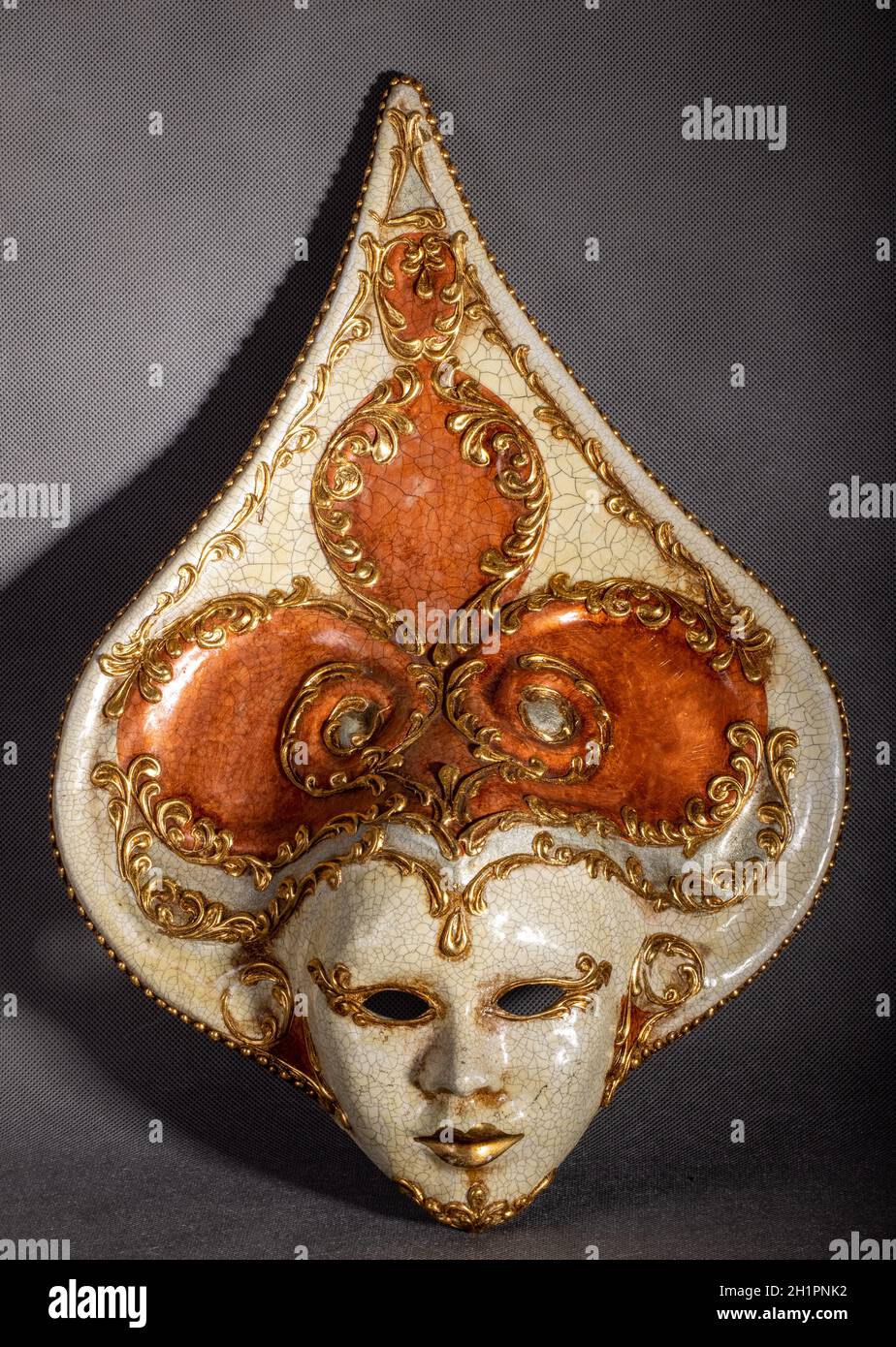 Traditional venetian carnival mask on grey background Stock Photo