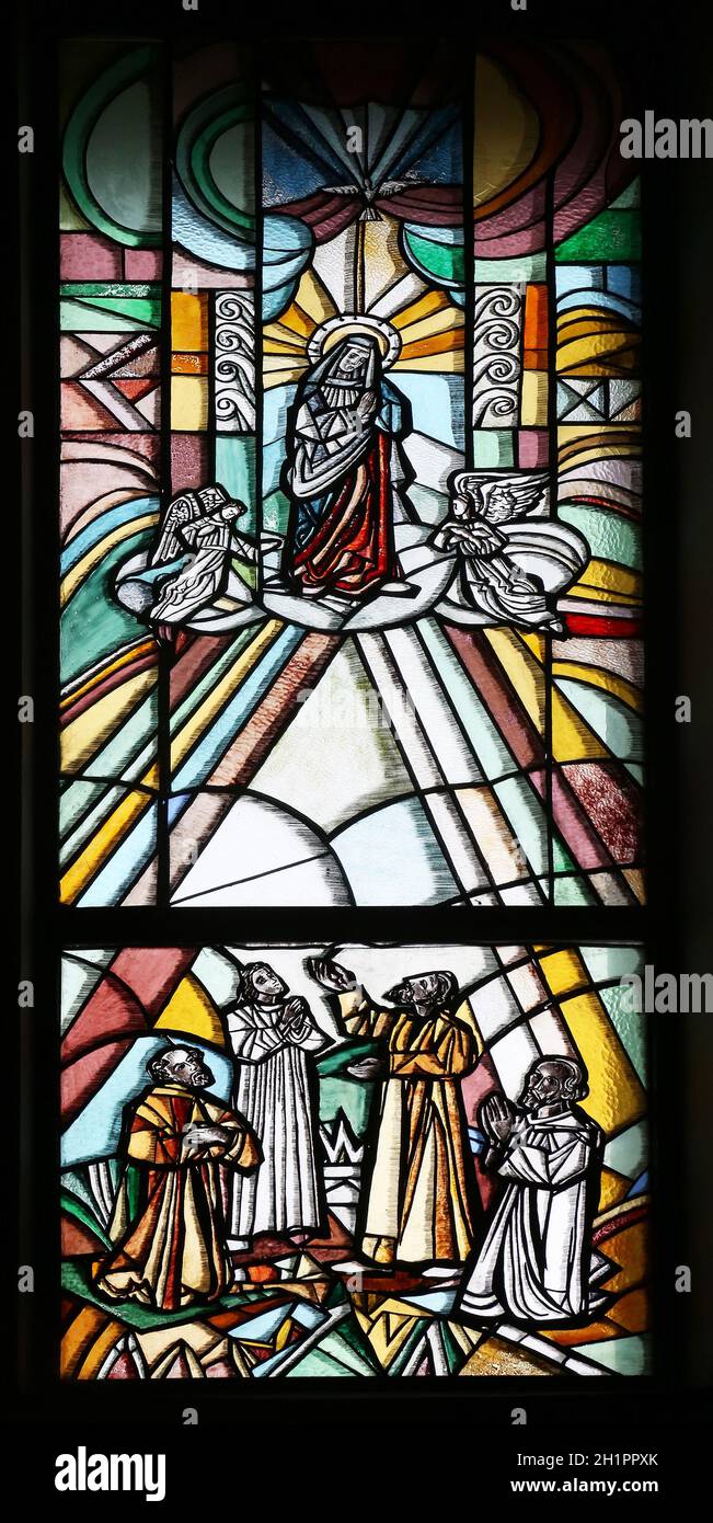 Assumption of the Virgin Mary, stained glass window in Parish church of the St. George in Durmanec, Zagorje region, Croatia Stock Photo