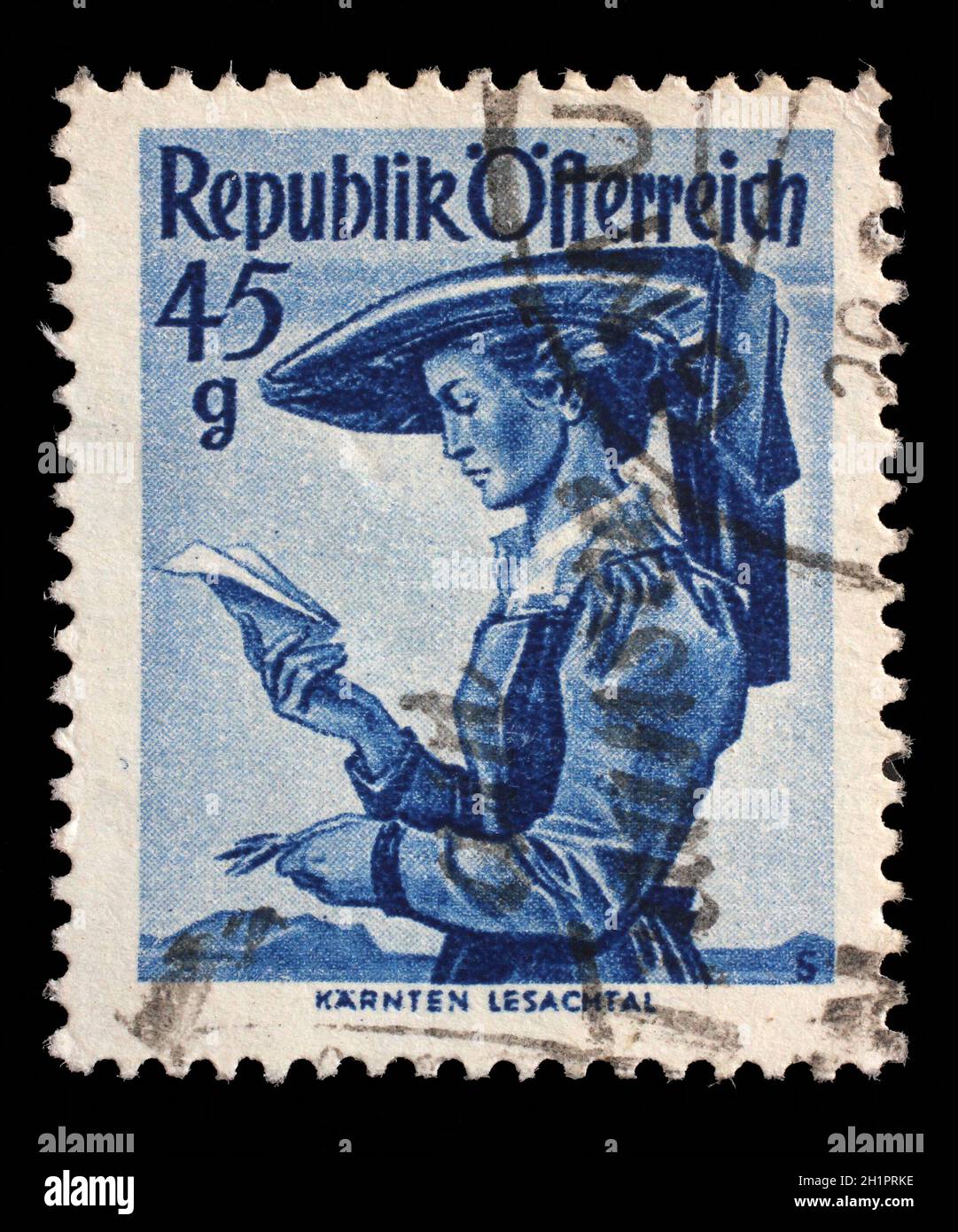 Stamp printed by Austria, shows woman from Carinthia, Lesachtal, Provincial Costumes series, circa 1948 Stock Photo