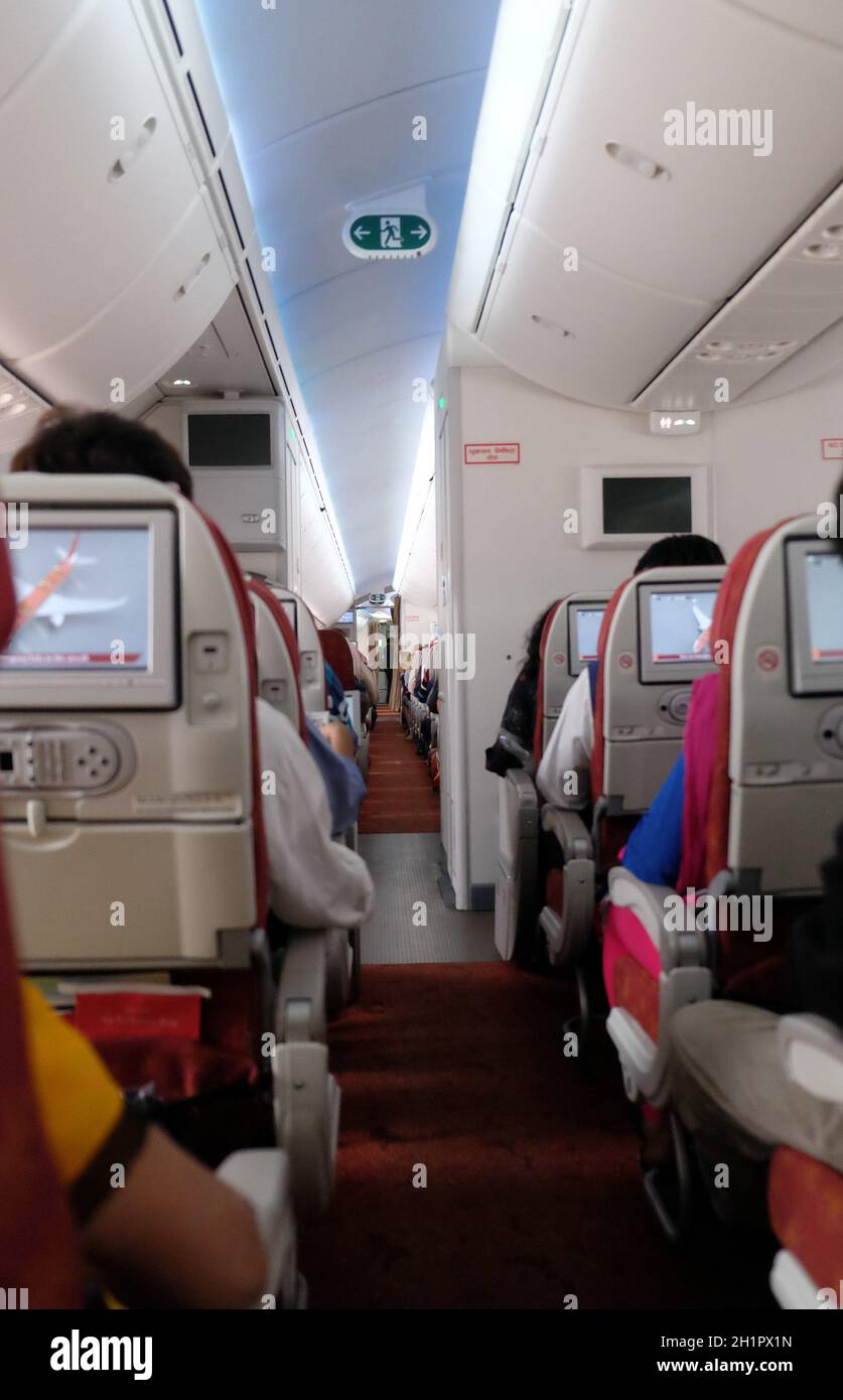 Airplane interior. Passengers waiting for taking off, Kolkata, India Stock Photo