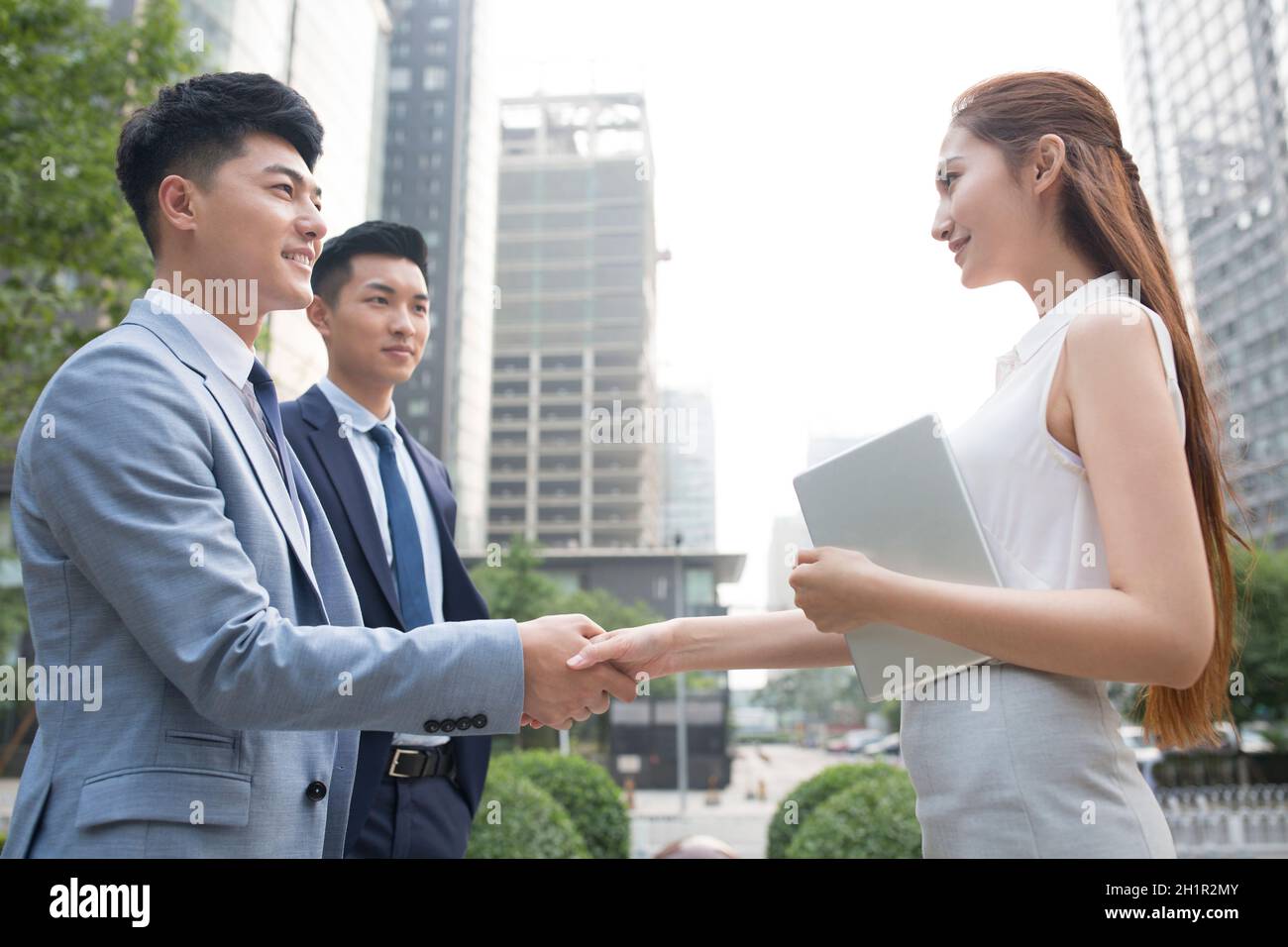 Confident businessmen shaking hands Stock Photo