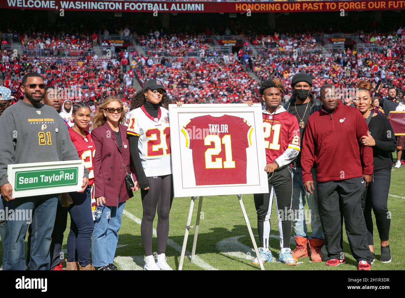 Sunday, October 17, 2021; Landover, MD, USA;  Members of former Washington Football Team safety Sean Taylor (21) pose for a photo during an NFL game a Stock Photo