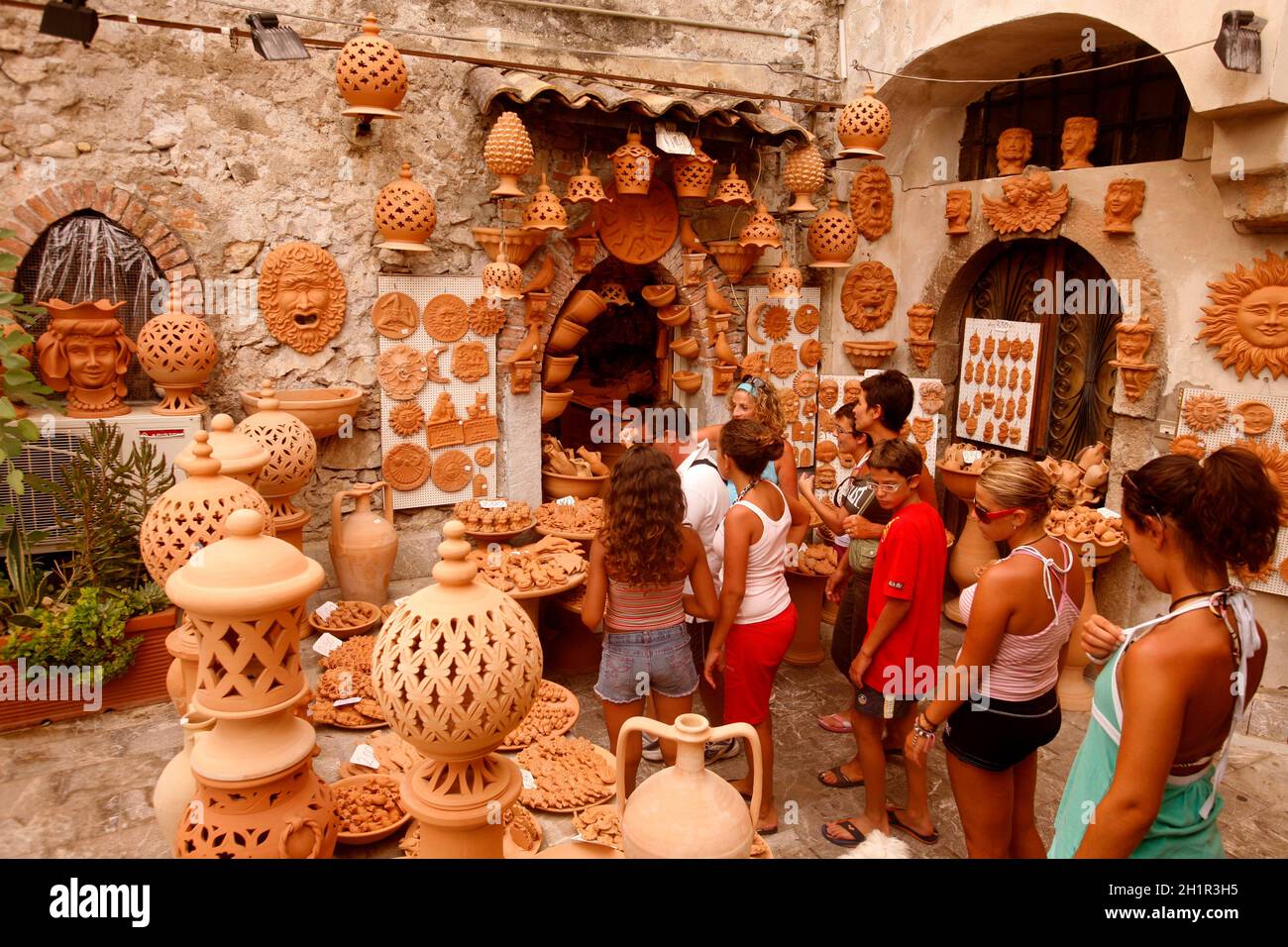a pottery shop at a street market in a alley in the centre in old Town of  Taormina in the province of Sicily in Italy.   Italy, Sicily, October, 2014 Stock Photo