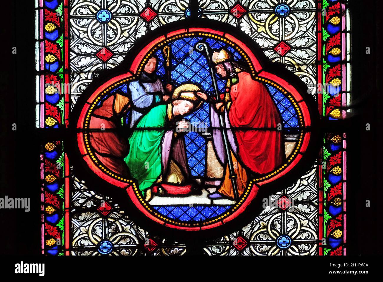 Saint Remi with stained glass window in the Basilica of Saint