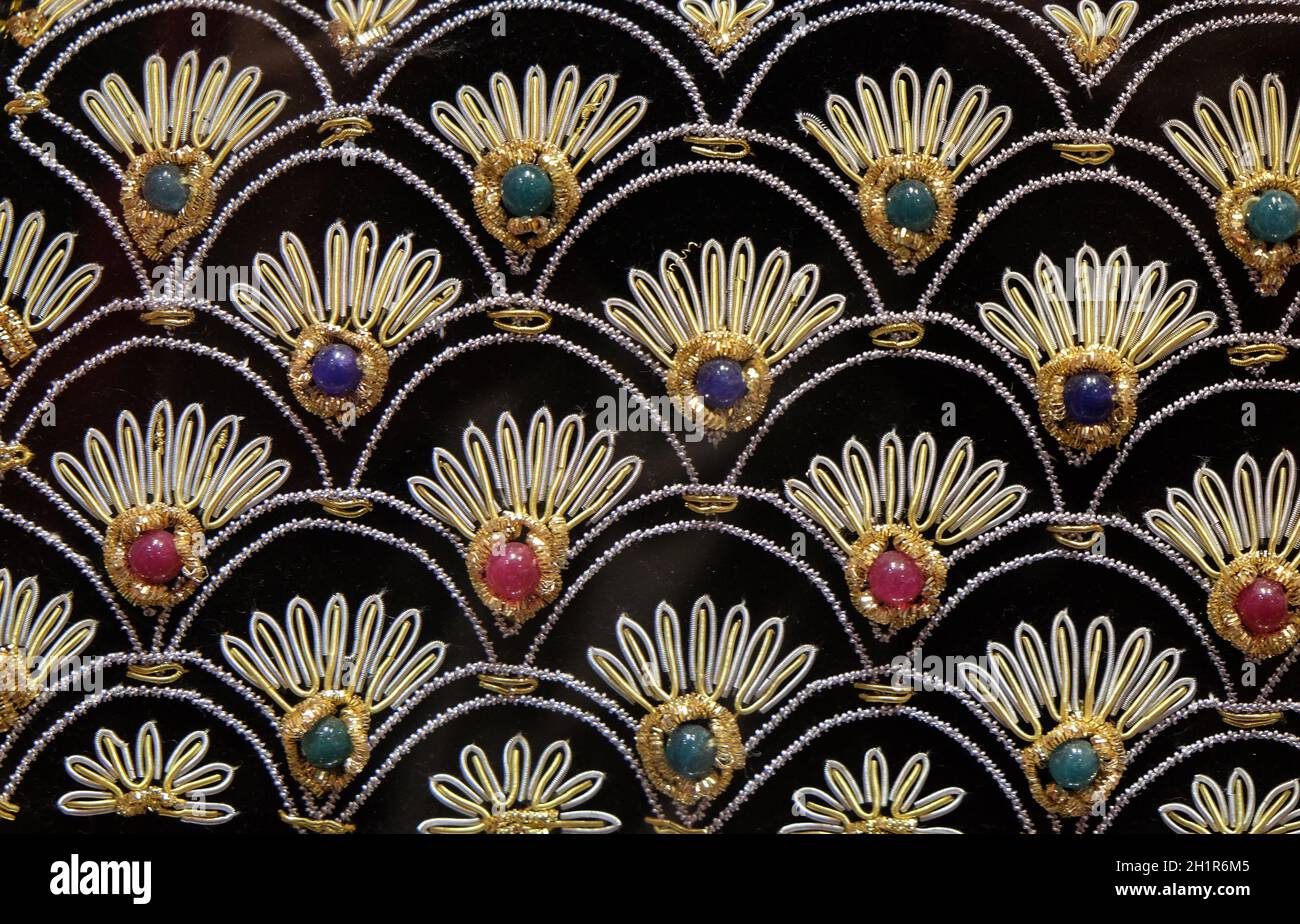 Handmade embroidered pillows on display at souvenir shop in Agra, Uttar