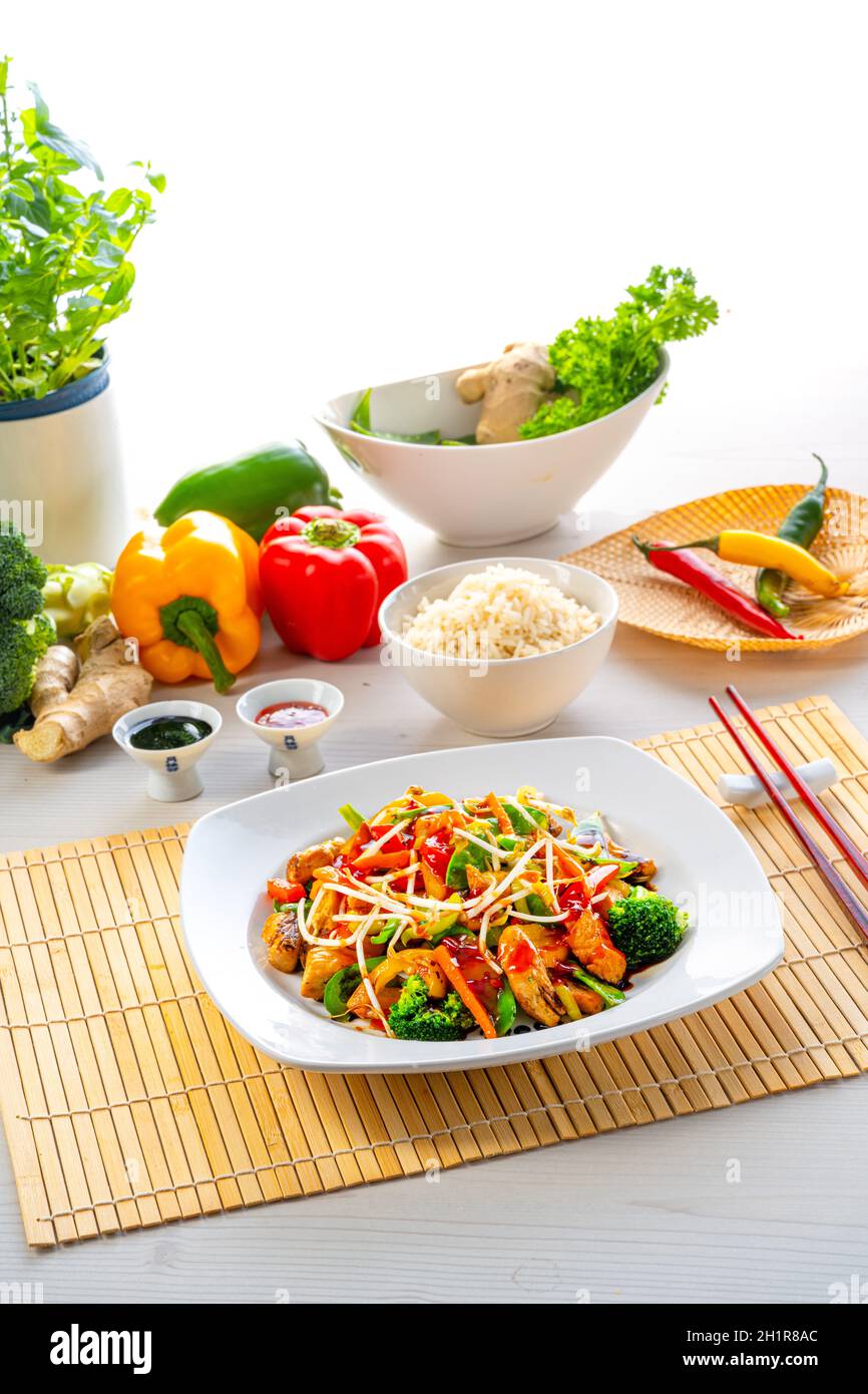 sweet and sour chicken with rice and vegetables Stock Photo Alamy