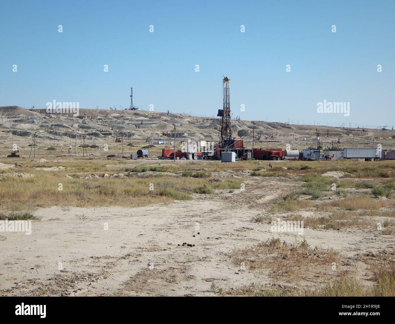 Drilling rig in the steppe. Oil field in the Mangistau region. Kazakhstan. 17 August. 2019 year. Stock Photo