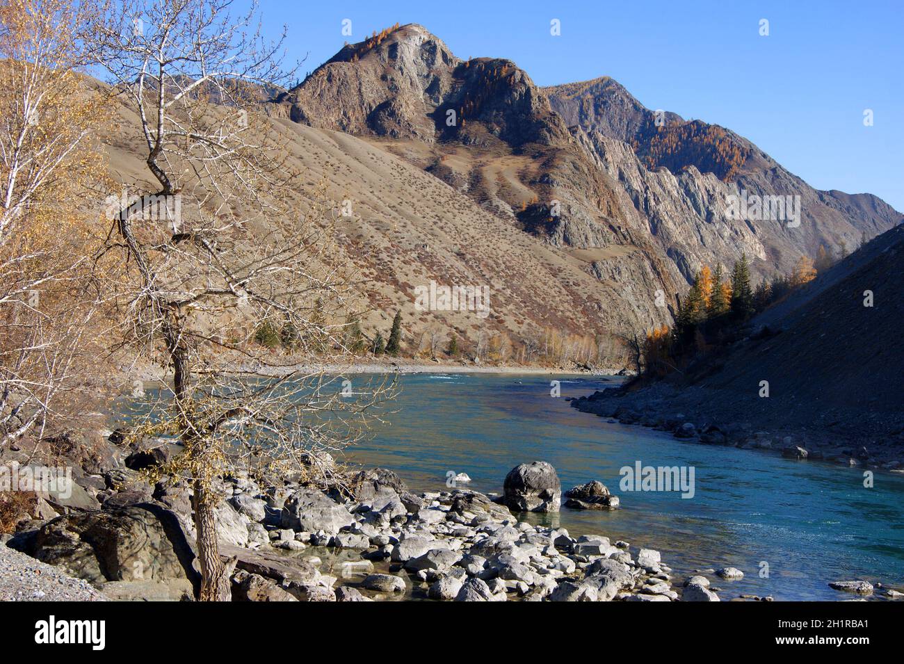 High mountains and tempestuous river in mountain by autumn Stock Photo