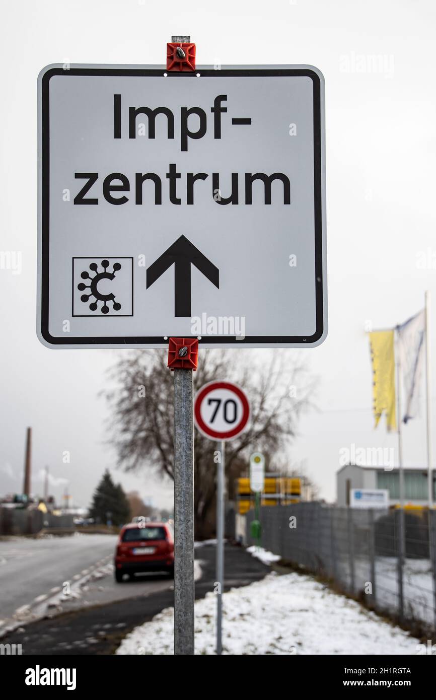 Street sign with german word for covid-19 vaccination center or center - vaccination center individually . Stock Photo