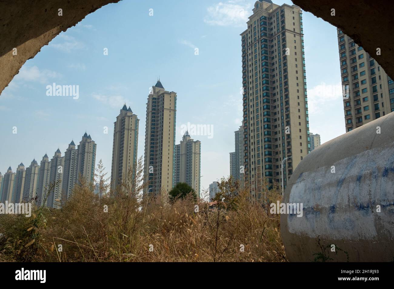 Evergrande Scenic Garden housing complex is seen from a cement tube in Wuqing, Tianjin, China. 19-Oct-2021 Stock Photo