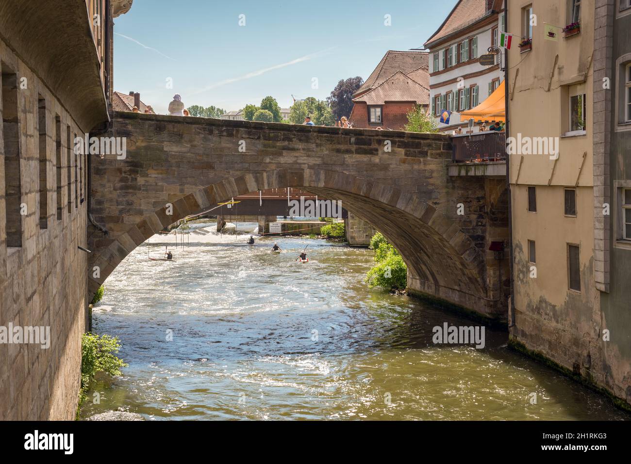 Bamberg, Germany - May 22, 2016: Old bridge over the Regnitz river in downtown of Bamberg, Upper Franconia, Bavaria, Germany. Bamberg is under UNESCO Stock Photo