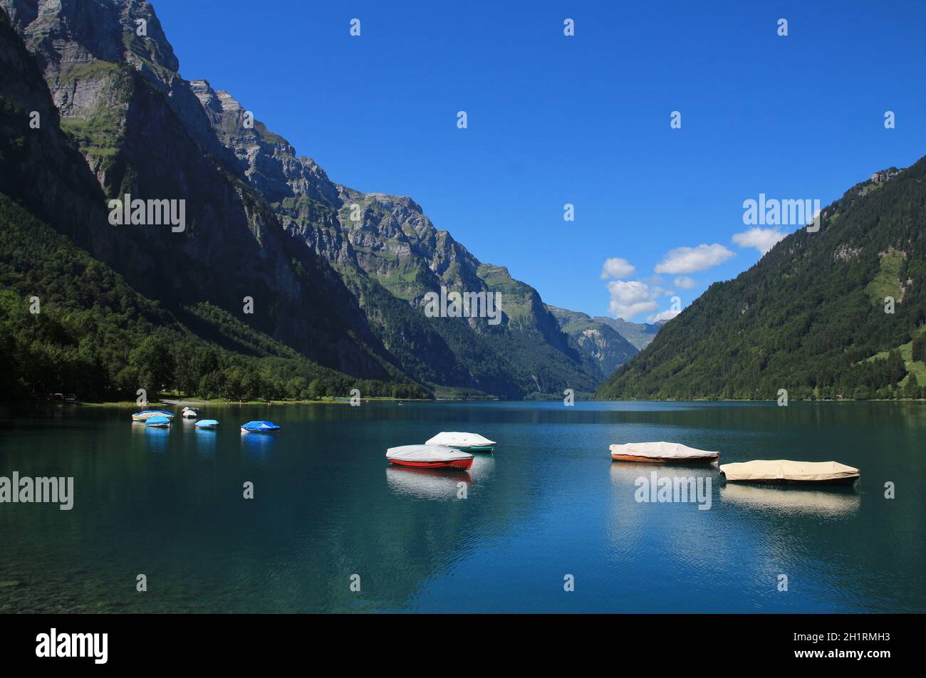Boats on the shore of lake Klontalersee Stock Photo