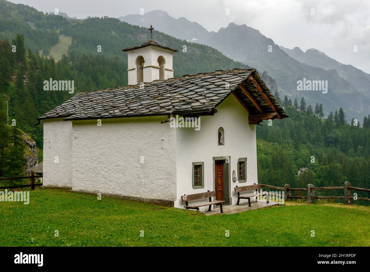 view of small mountain chapel, shot on a bright summer cloudy day near Gressoney la Trinite,  Lys valley, Aosta, Italy Stock Photo