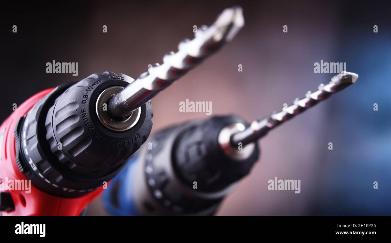Composition with two cordless drills also working as screw guns Stock Photo