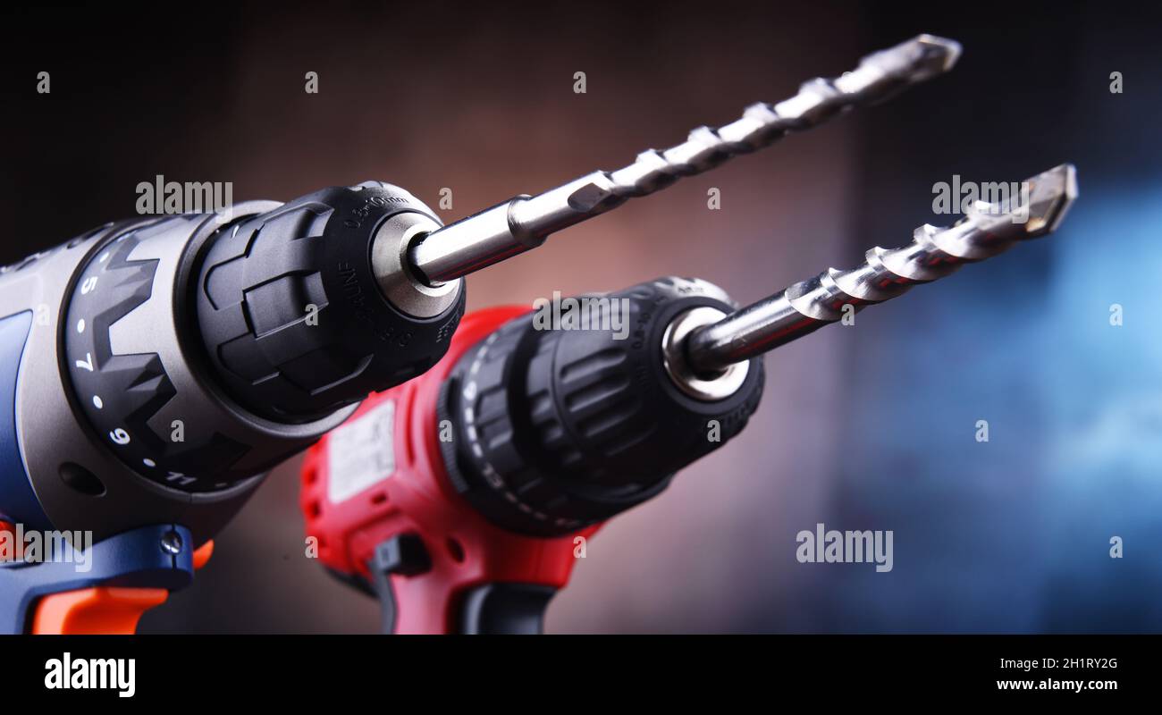 Composition with two cordless drills also working as screw guns Stock Photo