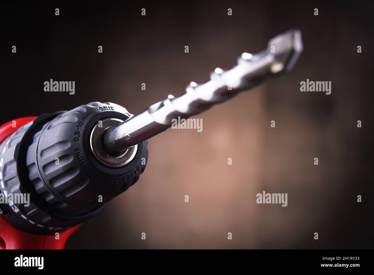 Composition with a cordless drill also working as a screw gun Stock Photo