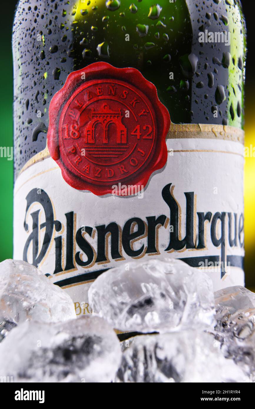 POZNAN, POL - FEB 18, 2021: Bottle of Plzensky Prazdroj, the first pilsner beer in the world, known better by its German name Pilsner Urquell Stock Photo