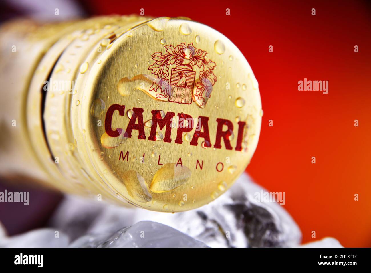 POZNAN, POL - FEB 25, 2021: Cap on a Campari bottle, an alcoholic liqueur containing herbs and fruit (including chinotto and cascarilla), invented in Stock Photo