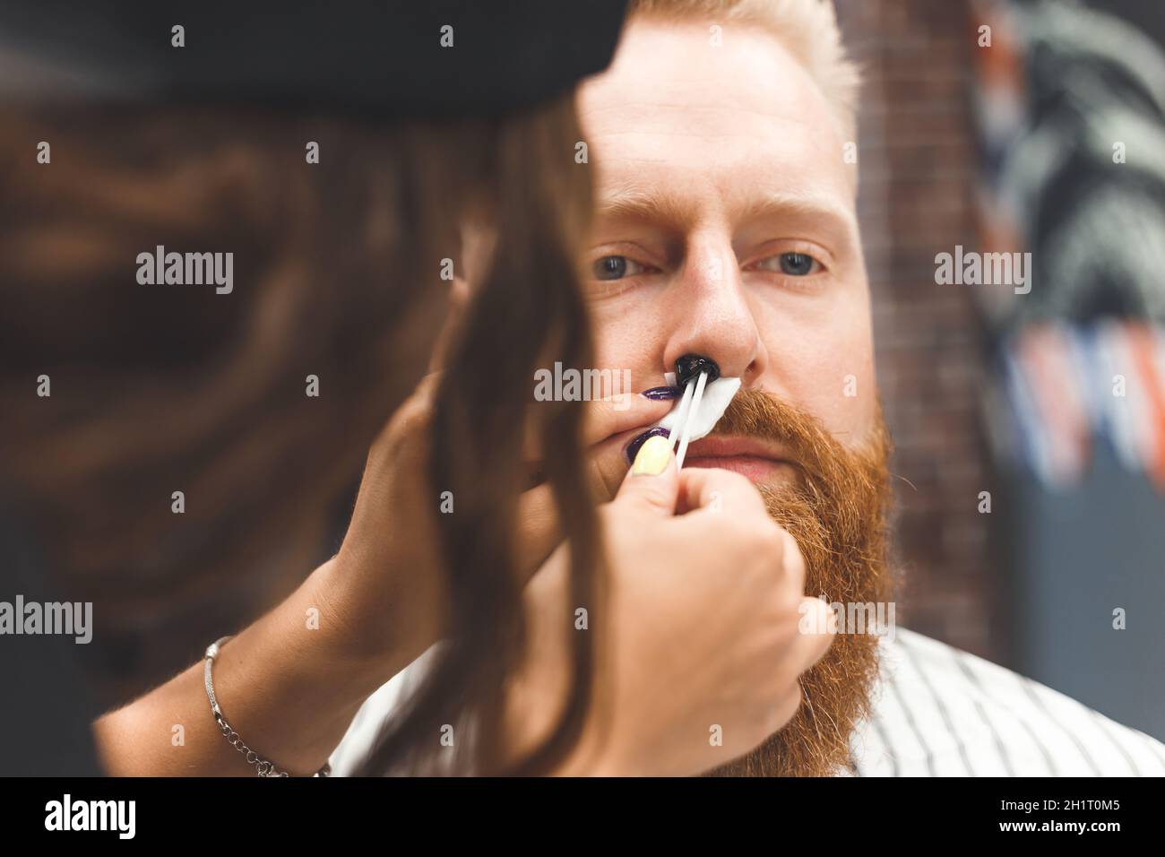 beard modeling in Barber shop, removing hair from the nose and ears ...