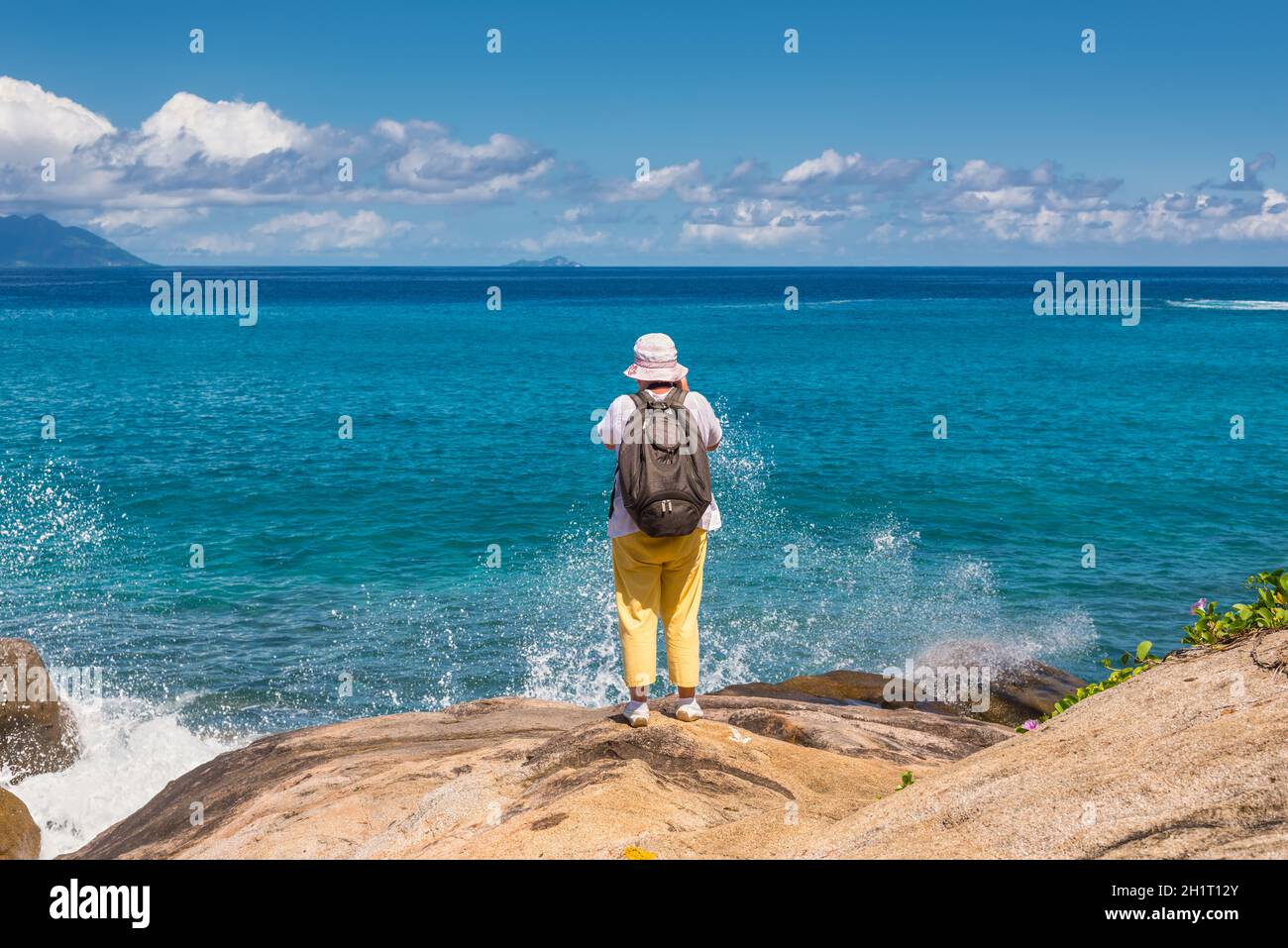 Anse Major, Mahe, Seychelles - December 16, 2015: Female tourist on the Anse Major Nature Trail in the hike near the town of Bel Ombre, Seychelles. Stock Photo