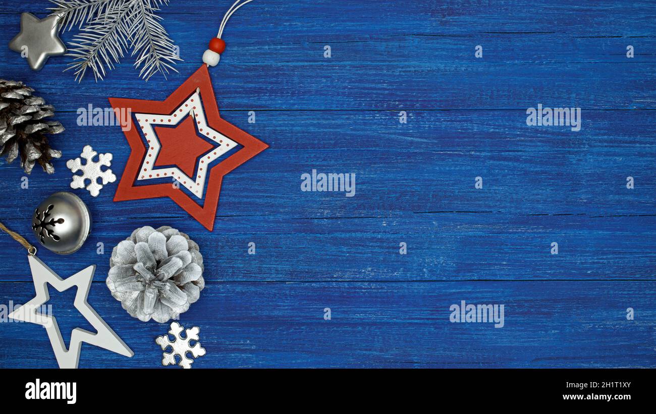 christmas decoration on blue painted wooden background. winter holiday greeting card. Stock Photo