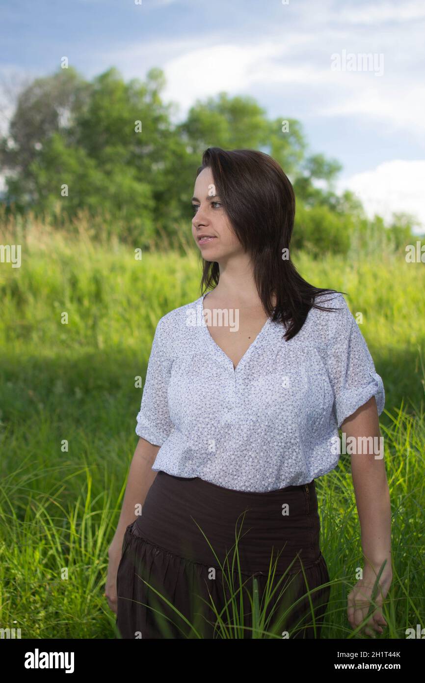 Girl in green field hi-res stock photography and images - Alamy